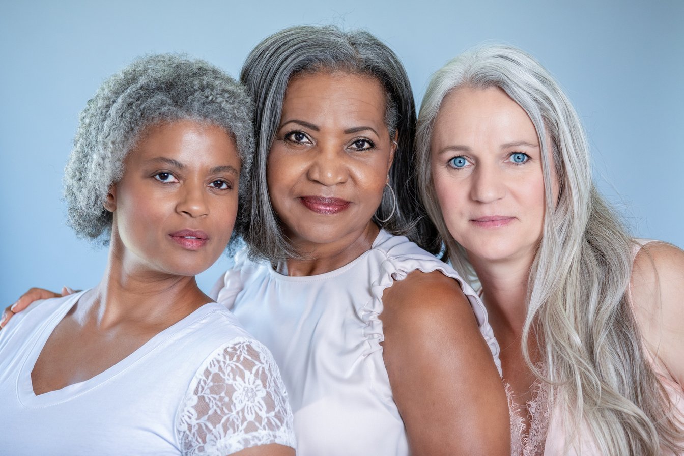 Beautiful portrait of three senior diverse women with gray hair